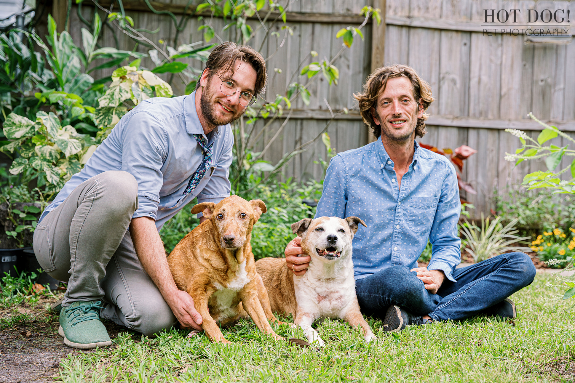 Family comfort: Adelaide and Aeva sit in between their dads. Photo by Hot Dog! Pet Photography.