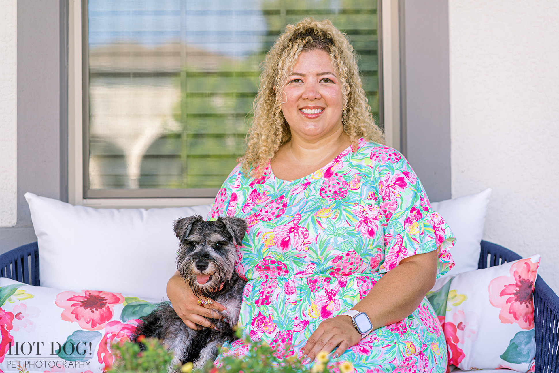 A captivating portrait of a miniature schnauzer puppy and his owner taken during a professional photo shoot in Osceola County, Florida